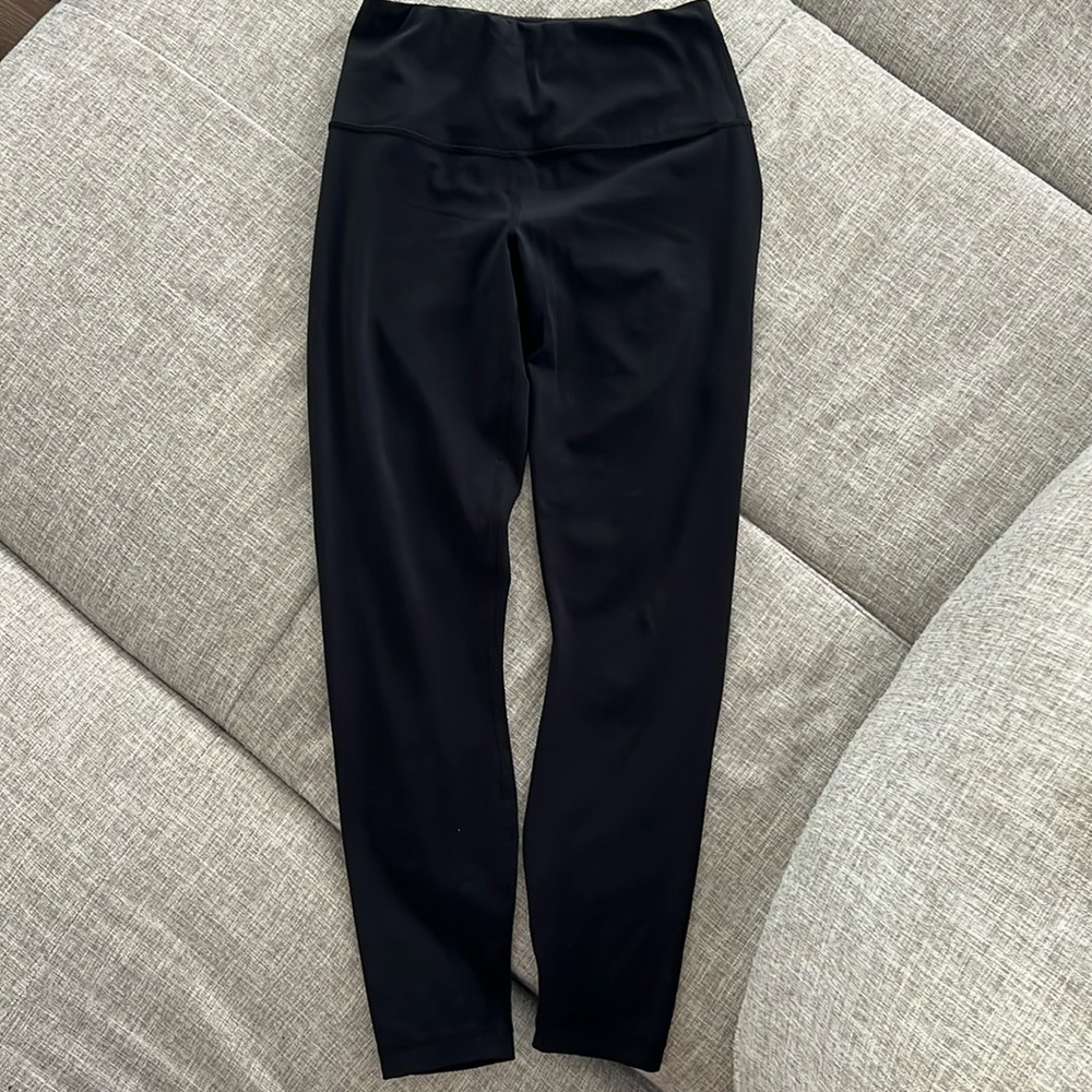 Black leggings, polyester, 90 Deg brand. Soft and comfy, athletic wear